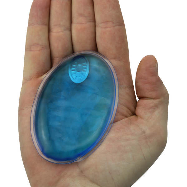 small blue hand warmer in adult hand